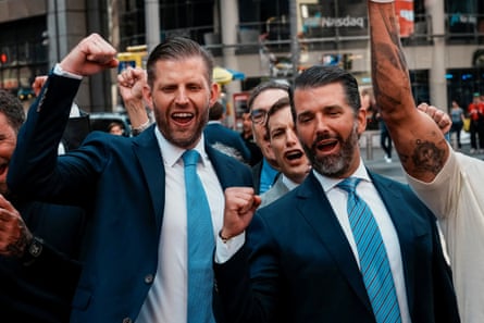Two men cheer with their fists up
