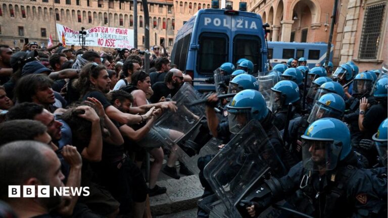 Italy protests: Dozens hurt in Bologna after man dies while being restrained by police