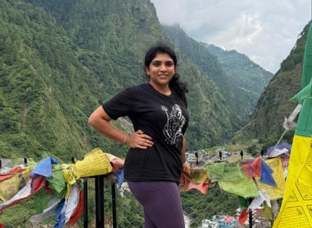 Suhasini Kandimalla stands in a green valley