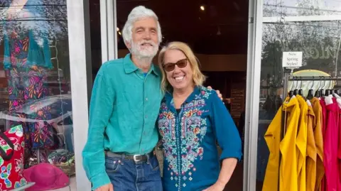Carley King Mike Roach and Kim Osgood outside their shop