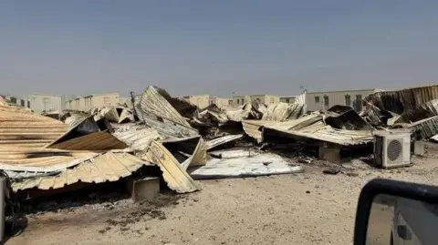 CBS News An undated photo of trailers destroyed by Iranian strike, Camp Buehring, Kuwait, obtained by CBS News.