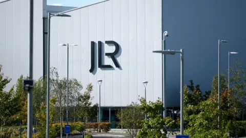 Getty Images A large white building with the letters JLR in black writing on the side
