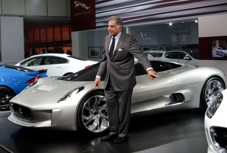 Late Tata Sons Chairman Ratan Tata conducts a media preview in front of a Jaguar C-X75 hybrid at the India Auto Expo in New Delhi on January 5, 2012