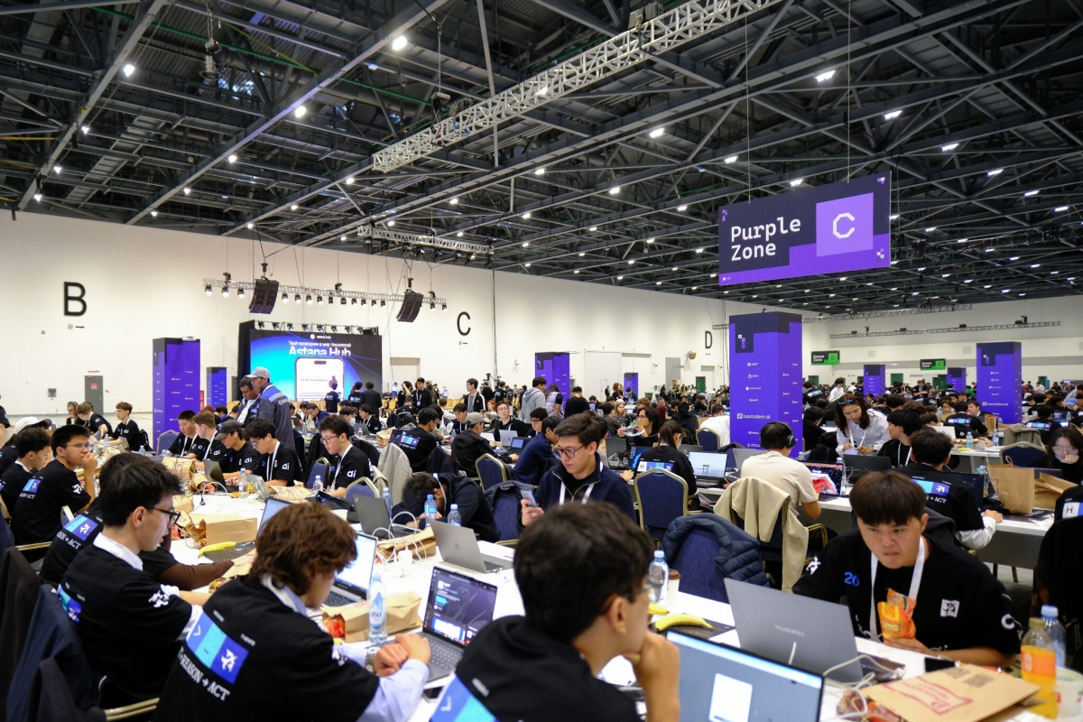 HackAlem AI Hackathon Participants in a large room sitting at computers