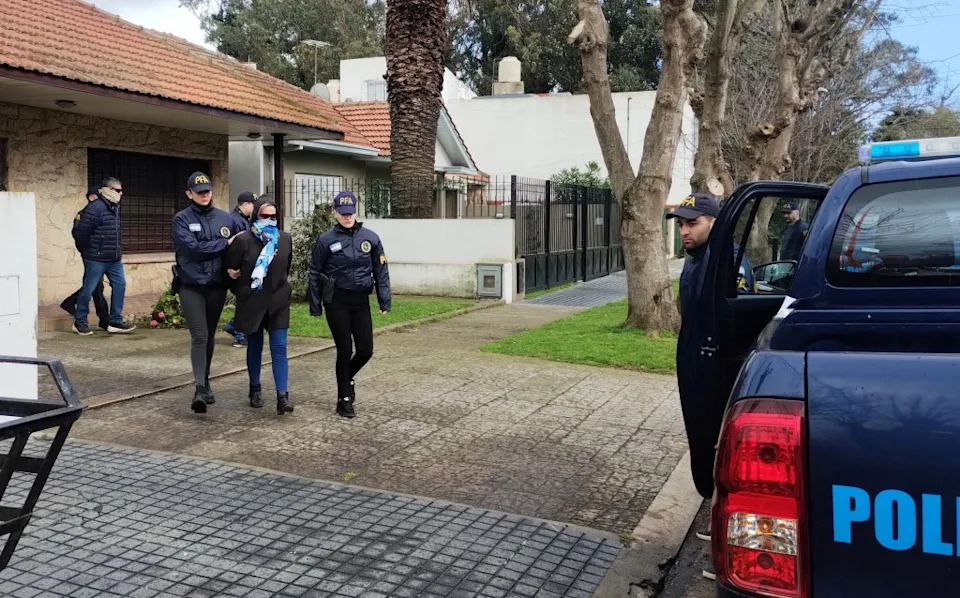 Argentine Federal Police escort Patricia Kadgien, daughter of a former Nazi official, and her husband, Juan Carlos Cortegoso, to a hearing on charges of concealment and obstruction of justice in Mar del Plata, Argentina, on Thursday, Sept. 4, 2025. REUTERS