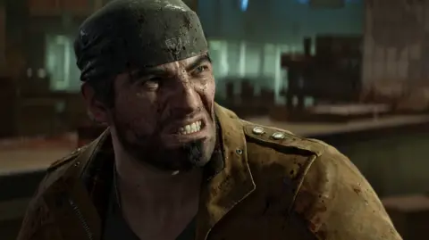 Xbox Game Studios Gears of War character Marcus Fenix wears a bandanna and a brown suede jacket. The CGI character has a cropped beard and blood-spattered face and grits his teeth.
