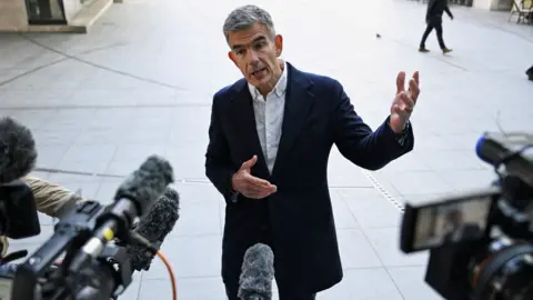 Reuters BBC director general Matt Brittin speaking to members of the media as he arrives for his first day at Broadcasting House in London in May 2026.