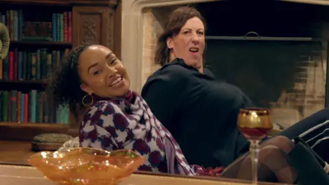 BBC/Studio Lambert Leigh-Anne and Miranda sitting on the floor and leaning backwards in the middle of a dance move