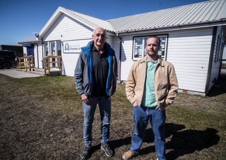 Mike Summers and Liam Short stand outside the chamber of commerce building in Port Stanley