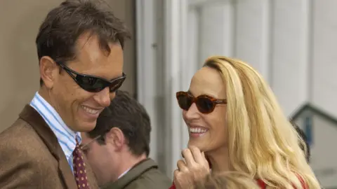 Rune Hellestad/Corbis via Getty Images Richard E Grant and Jerry Hall attending the Chelsea Flower Show