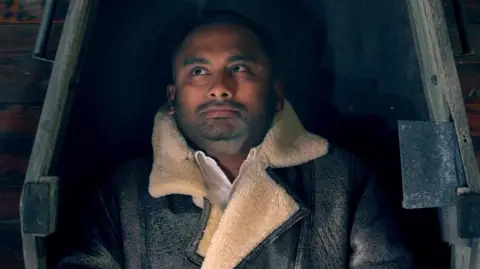 Amol Rajan seen in a coffin on Celebrity Traitors