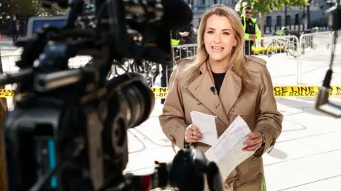 Reuters CNN White House correspondent Betsy Klein works near the White House, after reporters from CNN, Politico and MS NOW were barred from the White House on Thursday despite a judge's order calling for access to be restored immediately