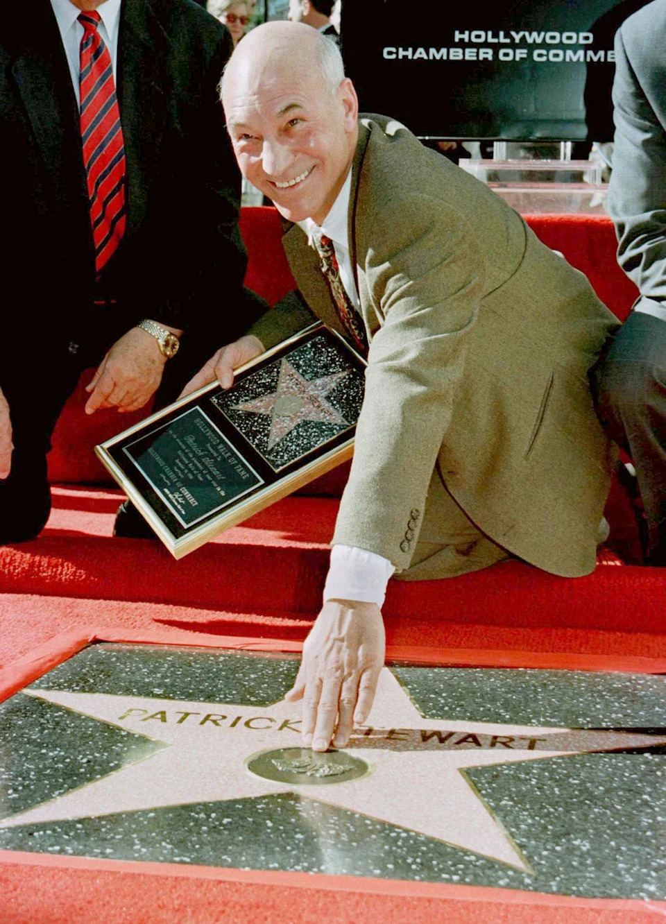 Stewart celebrates his newly unveiled star on the Hollywood Walk of Fame on Dec. 16, 1996 in Los Angeles.