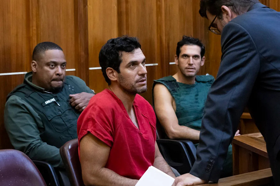 Oren Alexander, 37, center, and his twin brother, Alon (Matias J. Ocner / Miami Herald via Getty file)